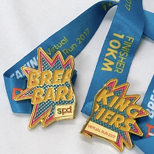 Breaking Barriers Virtual Run finisher medal with centrepiece detached as a magnet