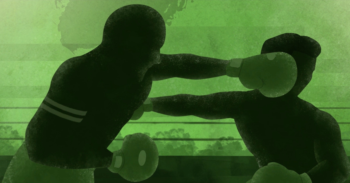 silhouette of two boxers exchanging punches in a green boxing ring